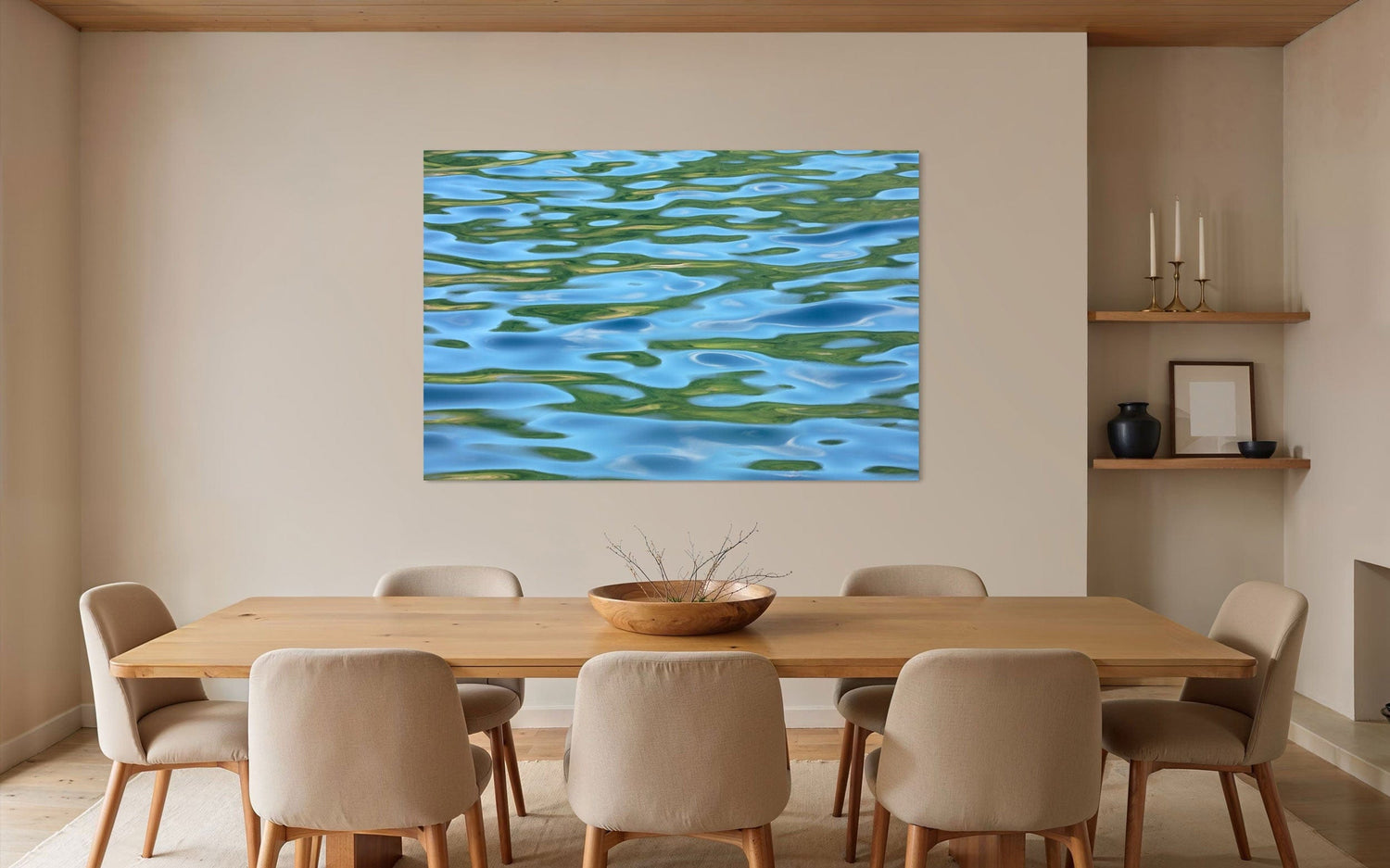 A piece of Washington art showing a Lake Sutherland photo hangs in a dining room.