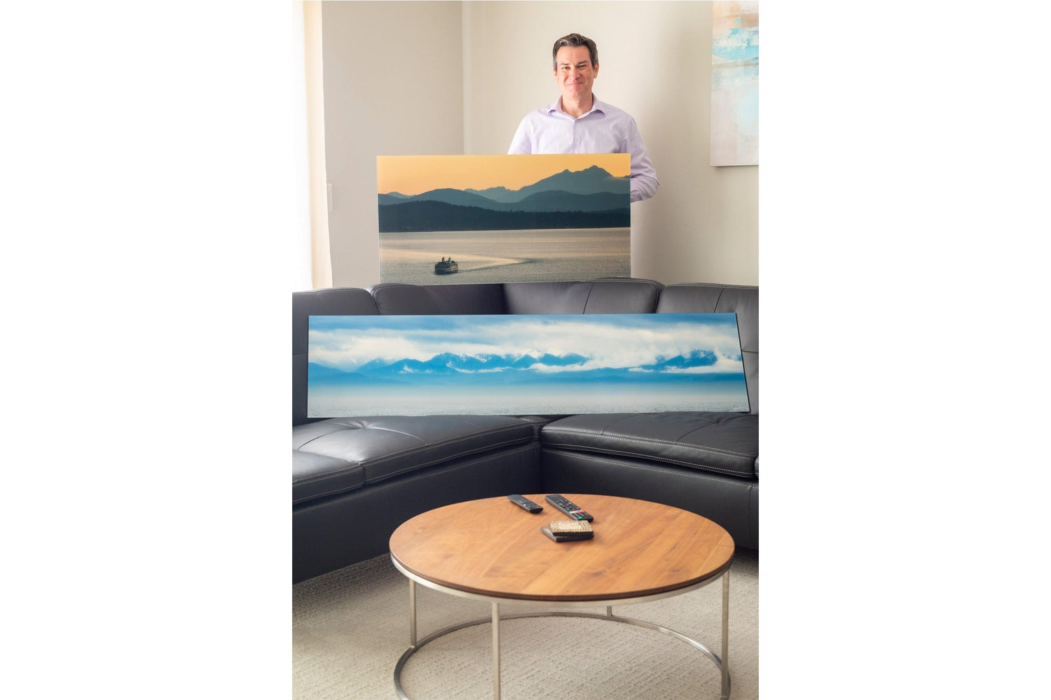 One of Lars Gesing's Seattle art collectors shows his Olympic Mountains art.