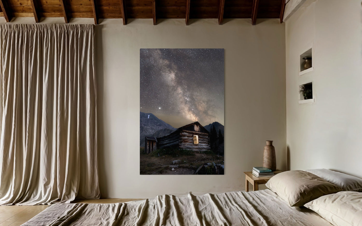 This piece of Colorado art showing photography of the milky way above Mayflower Gulch hangs in a bedroom.