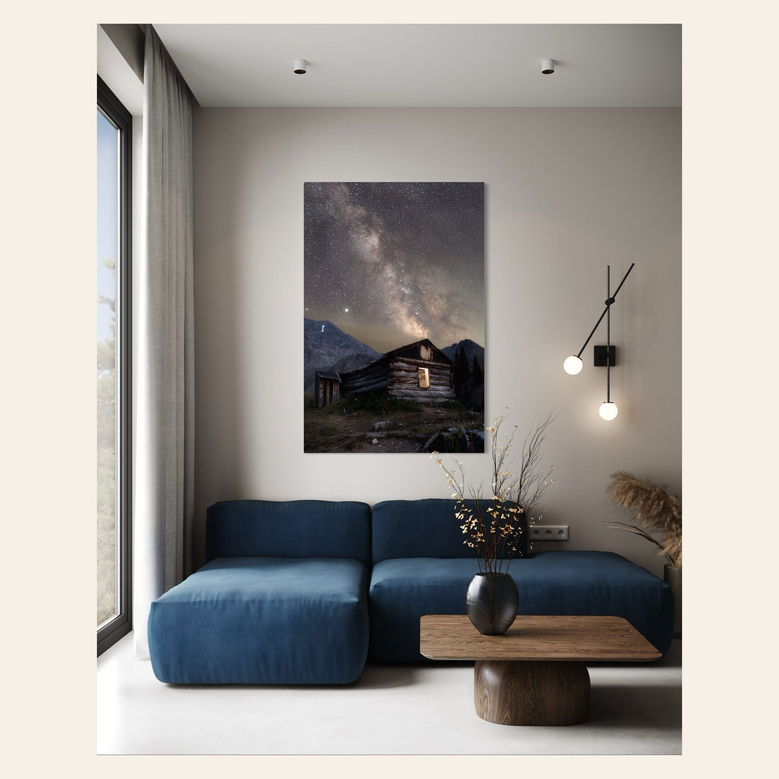 This piece of Colorado art showing photography of the milky way above Mayflower Gulch hangs in a living room.