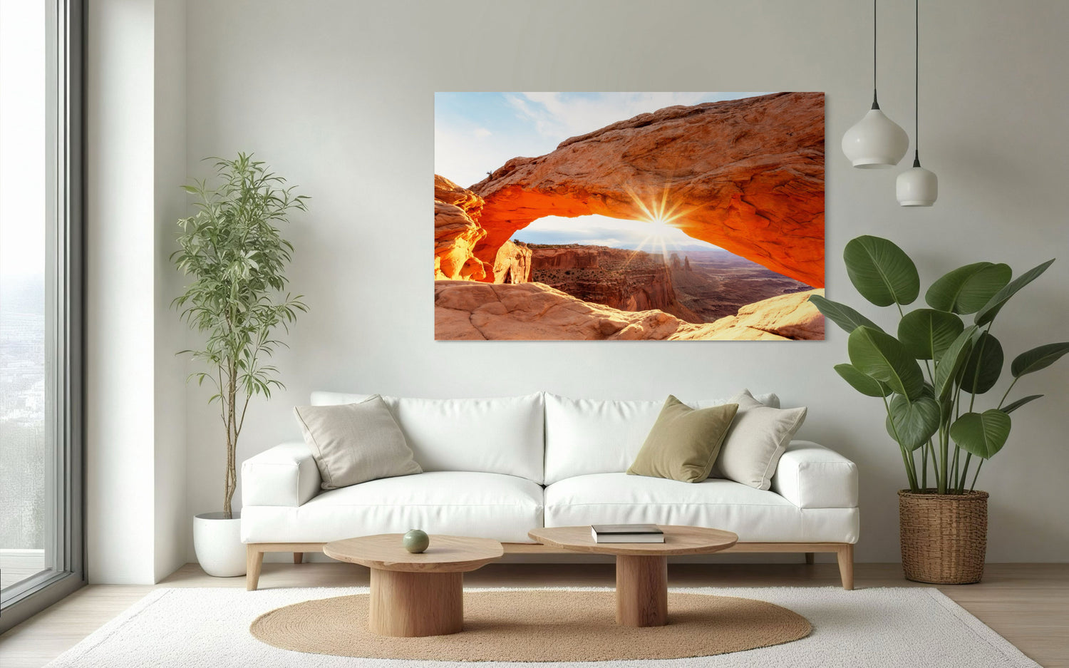 A piece of Moab art showing Mesa Arch in Canyonlands National Park hangs in a living room.