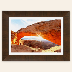 A piece of framed Moab art showing Mesa Arch in Canyonlands National Park.