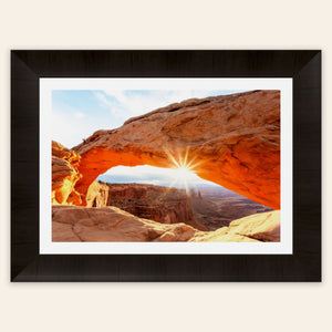 A piece of framed Moab art showing Mesa Arch in Canyonlands National Park.