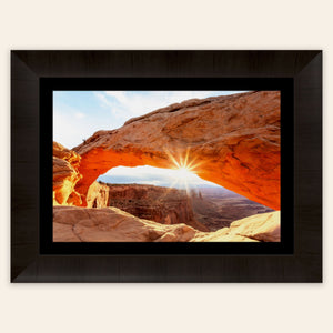 A piece of framed Moab art showing Mesa Arch in Canyonlands National Park.