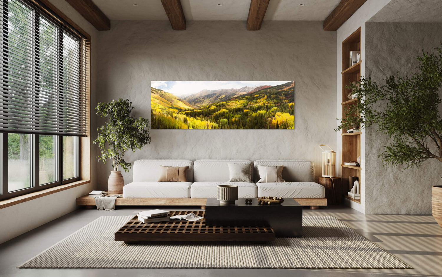 A piece of Colorado art showing the Million Dollar Highway fall colors hangs in a living room.