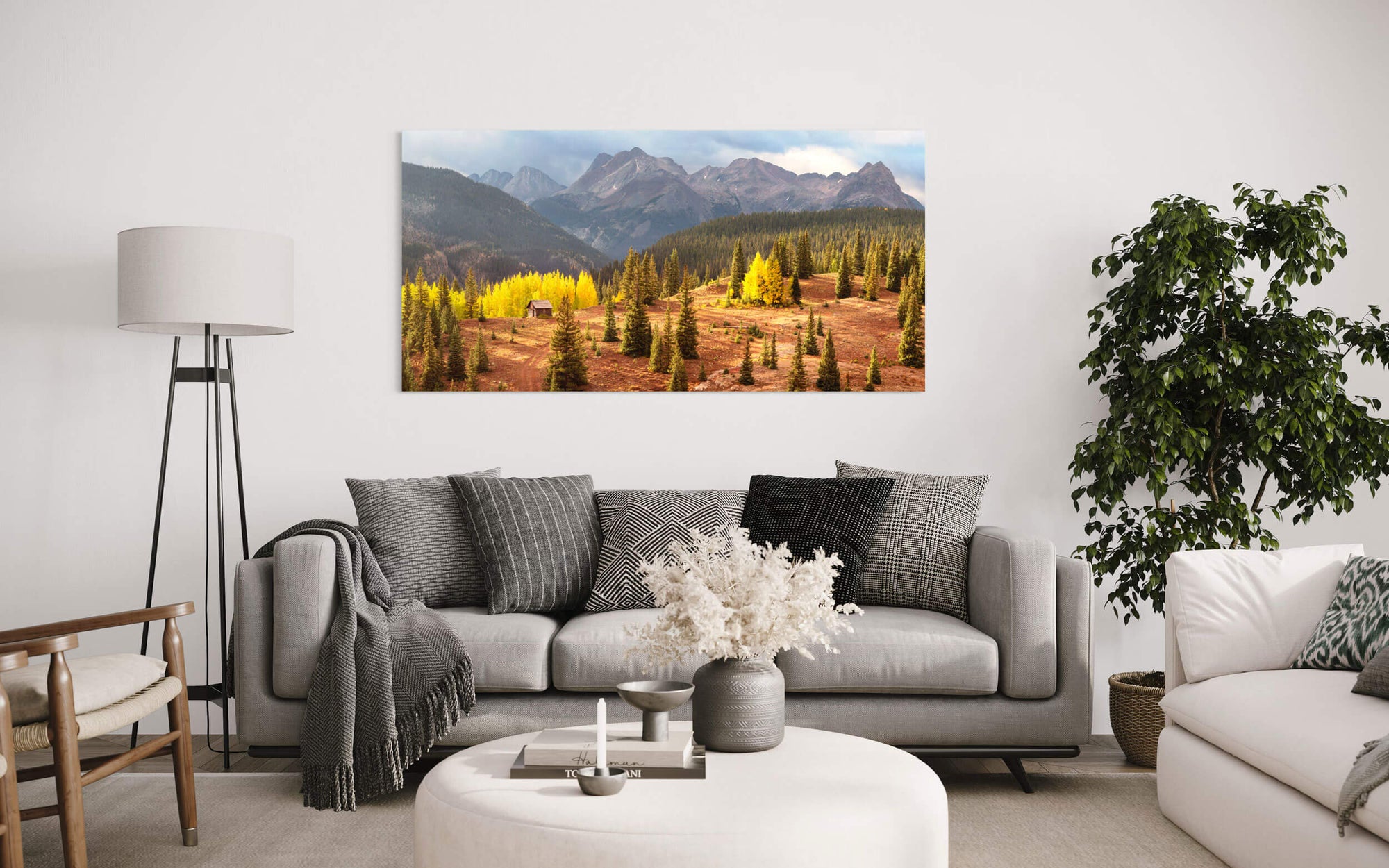 A cabin picture from Molas Pass near Silverton during peak Colorado fall hangs in a living room.