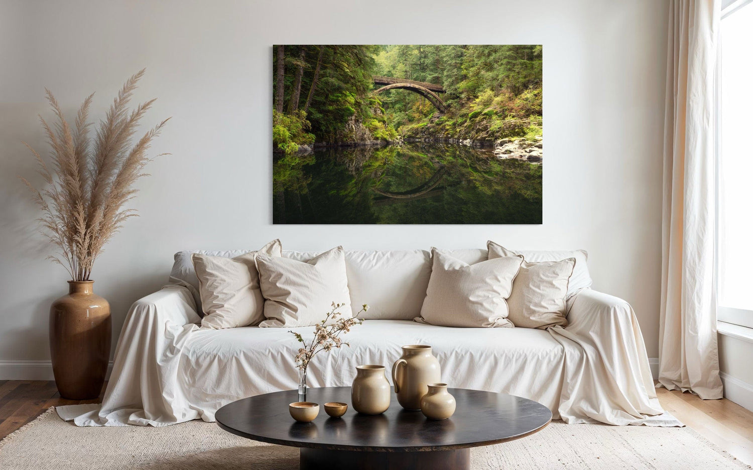 A piece of Washington art showing a Moulton Falls photo hangs above a couch.