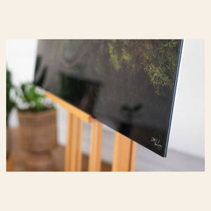 A closeup of a piece of Washington art showing a Moulton Falls photo.