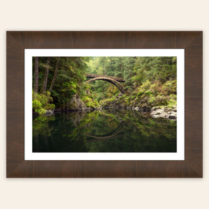 A piece of framed Washington art showing a Moulton Falls photo.