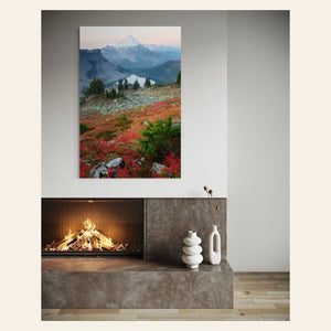 A piece of Mount Baker wall art showing fall colors hangs above a fireplace.