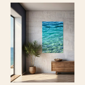 A piece of Mount Rainier wall art showing a lake in the national park in the morning light hangs in a living room.