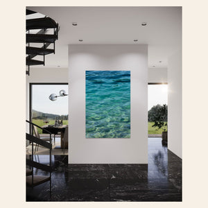 A piece of Mount Rainier wall art showing a lake in the national park in the morning light hangs in a foyer.