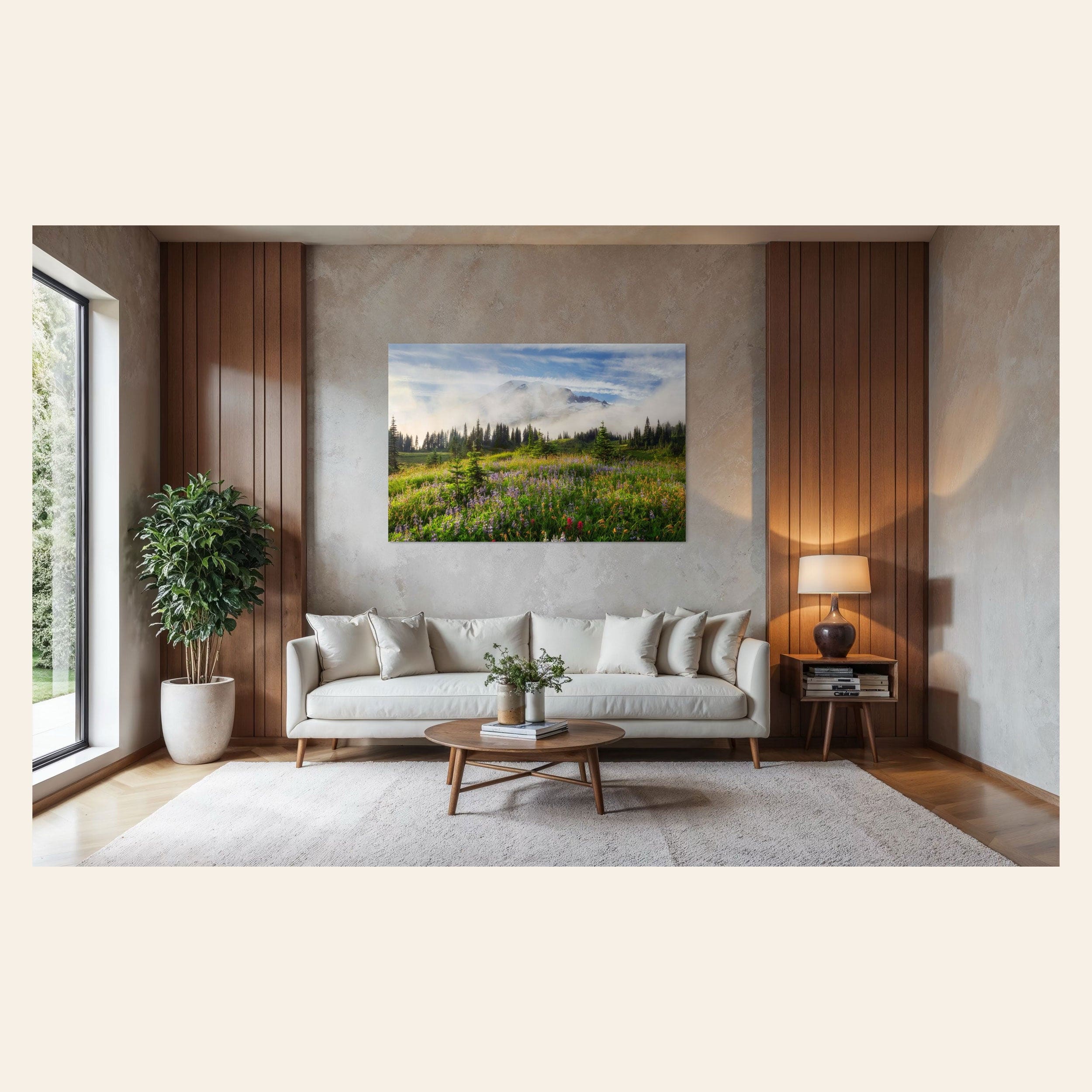 A piece of Mount Rainier art showing a wildflower photo at Paradise hangs over a couch.