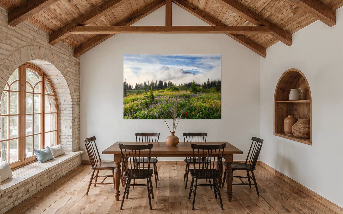 A piece of Mount Rainier art showing a wildflower photo at Paradise hangs in a dining room.