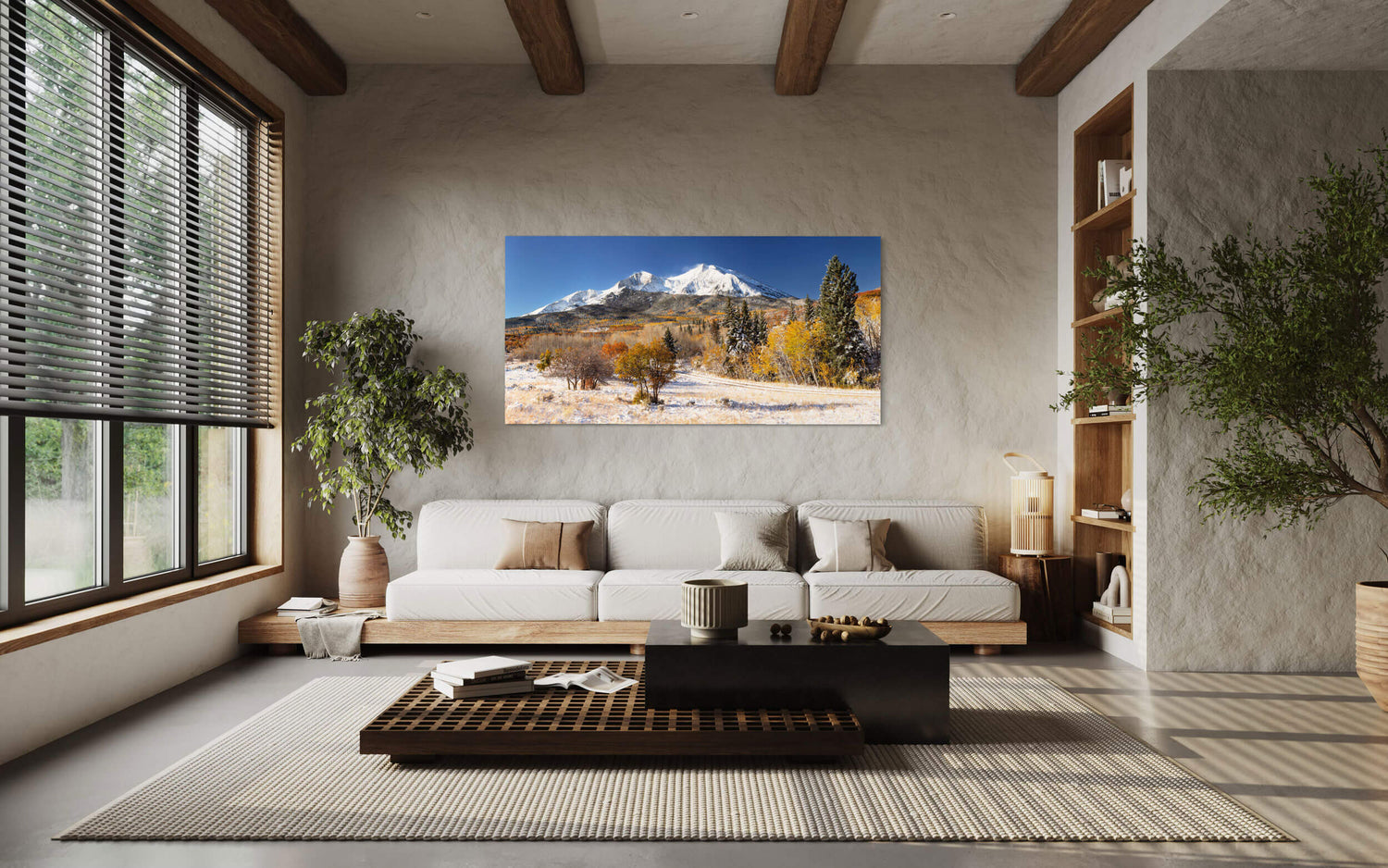 A piece of Colorado art showing Mount Sopris in Carbondale in fall hangs in a living room.