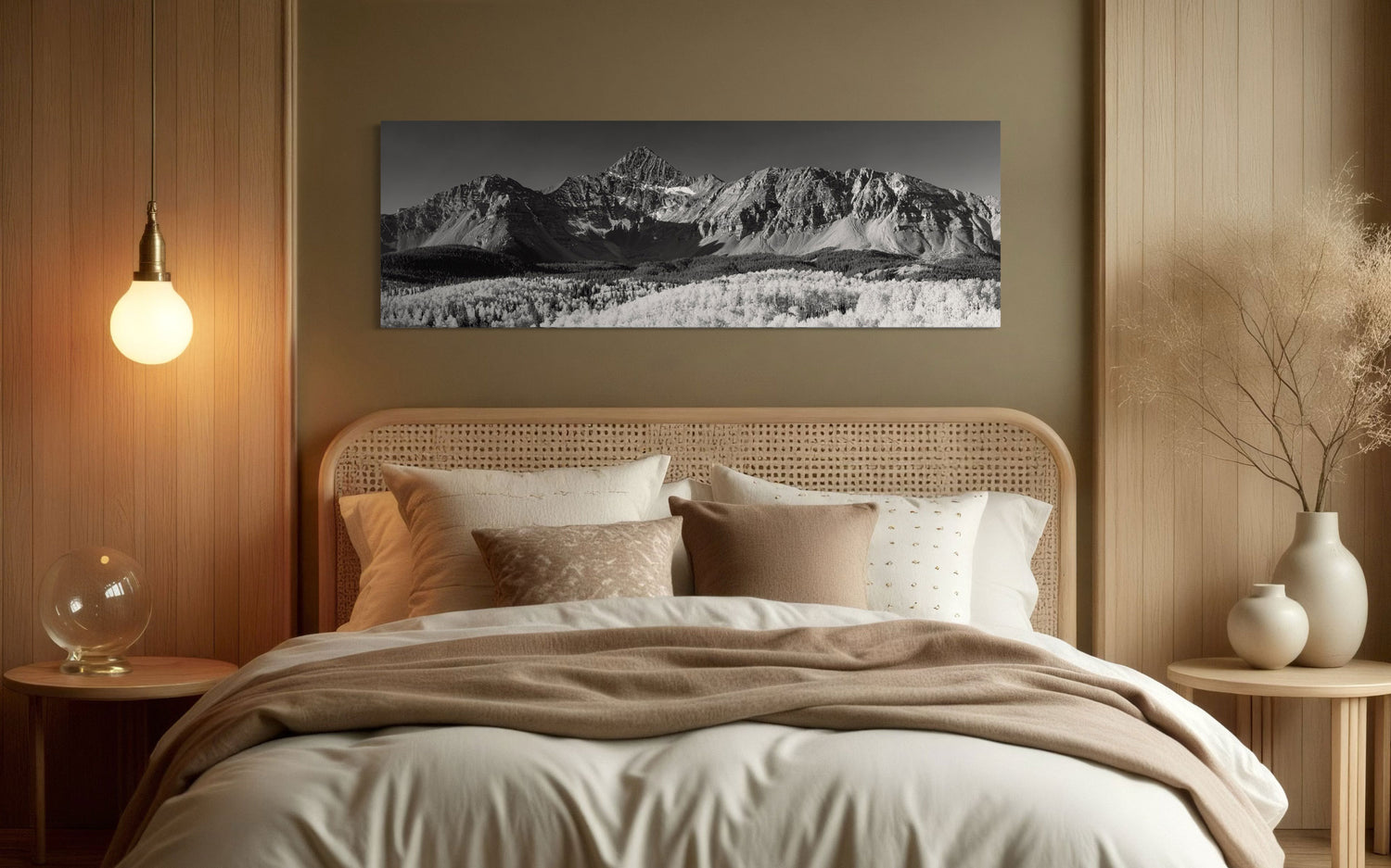 A piece of Telluride art showing a black and white photography print of Mount Wilson hangs in a bedroom.