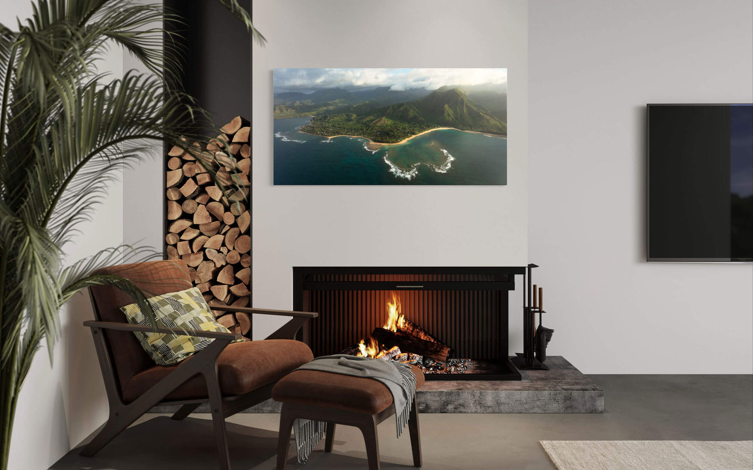 A piece of Napali Coast art showing a Ke'e Beach picture from Kauai hangs in a living room.