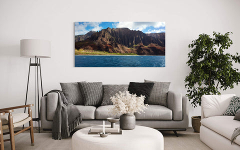 A Napali coast picture made on a Kauai boat tour hangs in a living room.