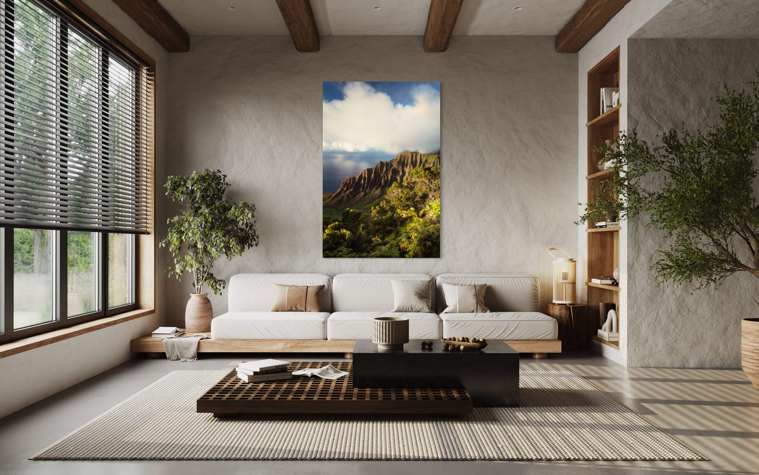 A piece of Kauai art shows the Napali Coast from Kalalau Valley Overlook hanging in a living room.