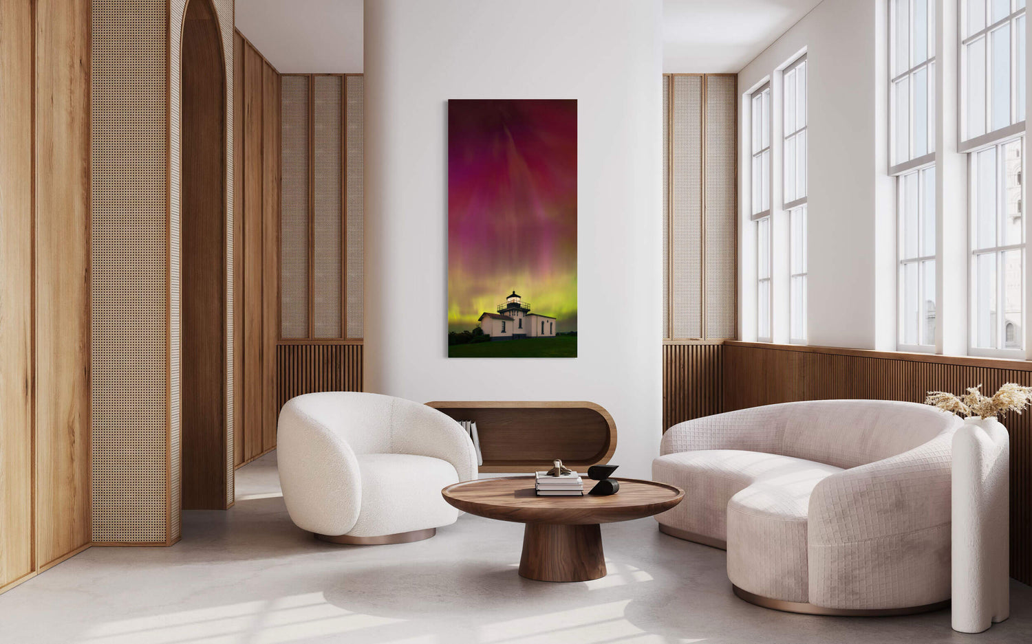 A Washington Northern Lights photography print hangs in a living room.