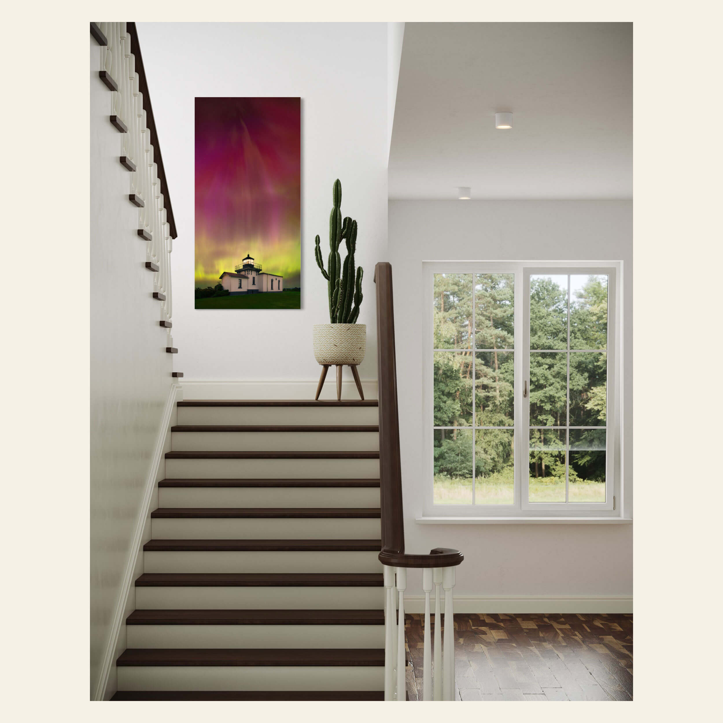 A Washington Northern Lights photography print hangs in a staircase.