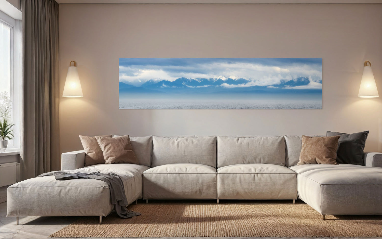 A piece of wall art showing an Olympic Mountains panorama photo hangs in a living room.