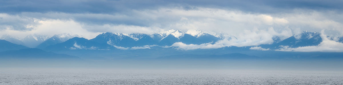 An Olympic Mountains panorama photograph.
