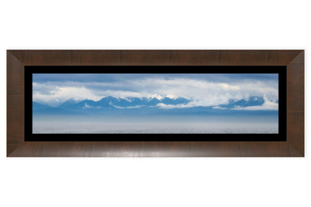 A framed Olympic Mountains panorama photograph.