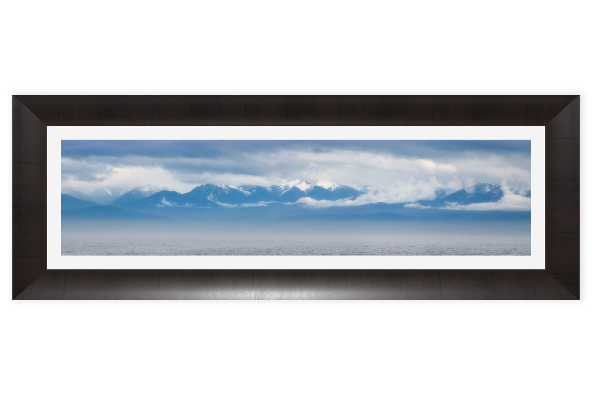 A framed Olympic Mountains panorama photograph.