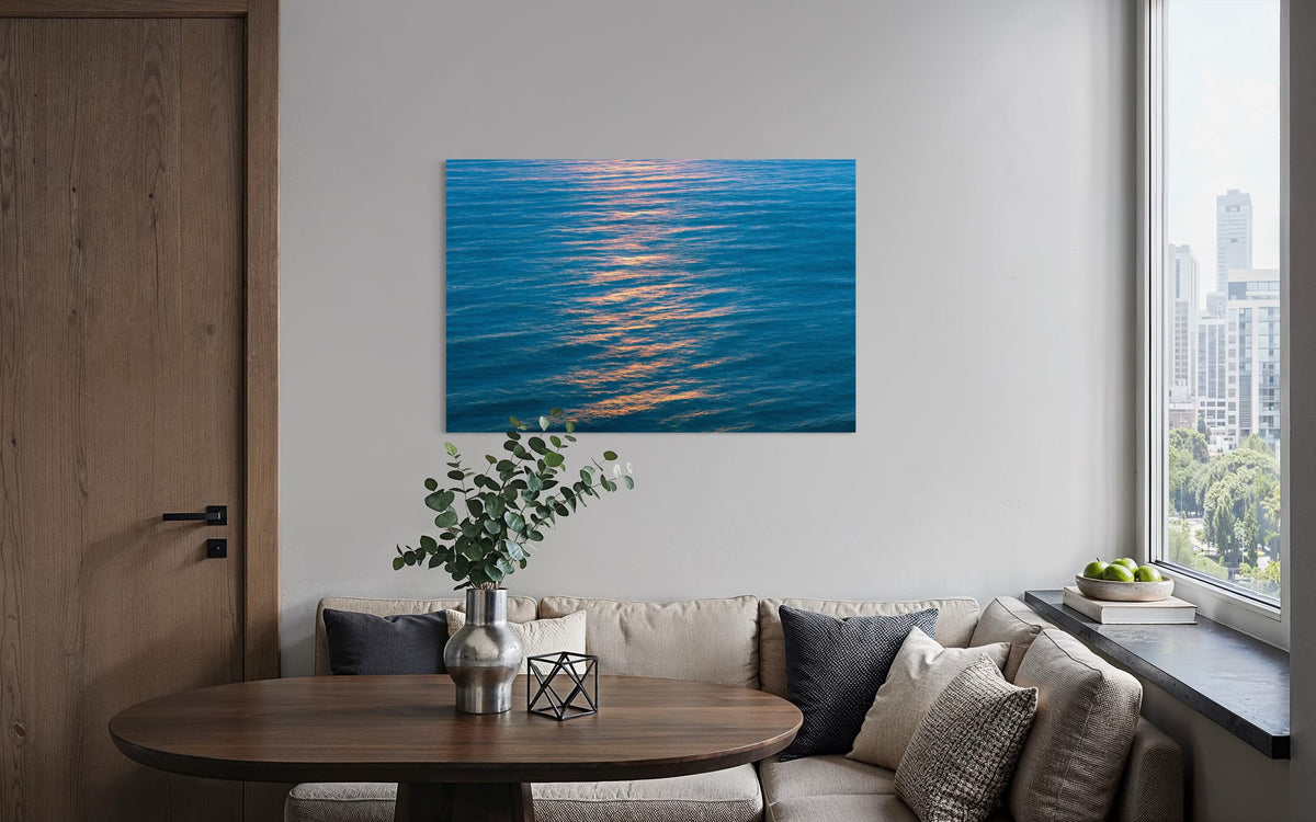 An ocean sunset photo hangs in a condo sitting area. | Lars Gesing Fine Art | Coastal Wall Art