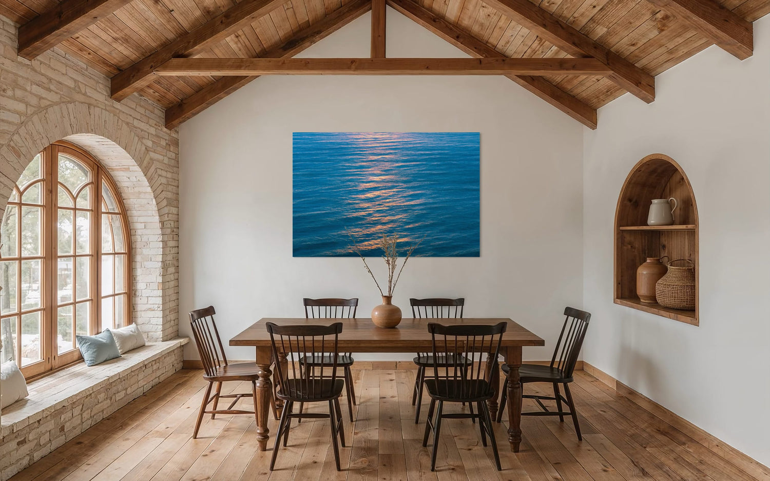 An ocean sunset photo hangs in a dining room. | Lars Gesing Fine Art | Coastal Wall Art