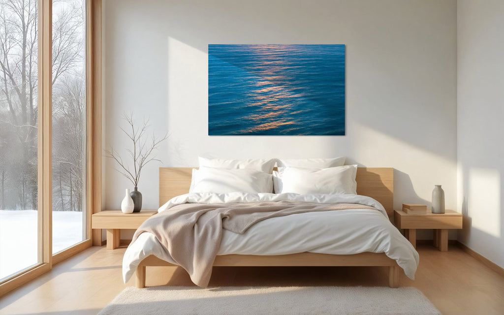 An ocean sunset photo hangs in a bedroom. | Lars Gesing Fine Art | Coastal Wall Art