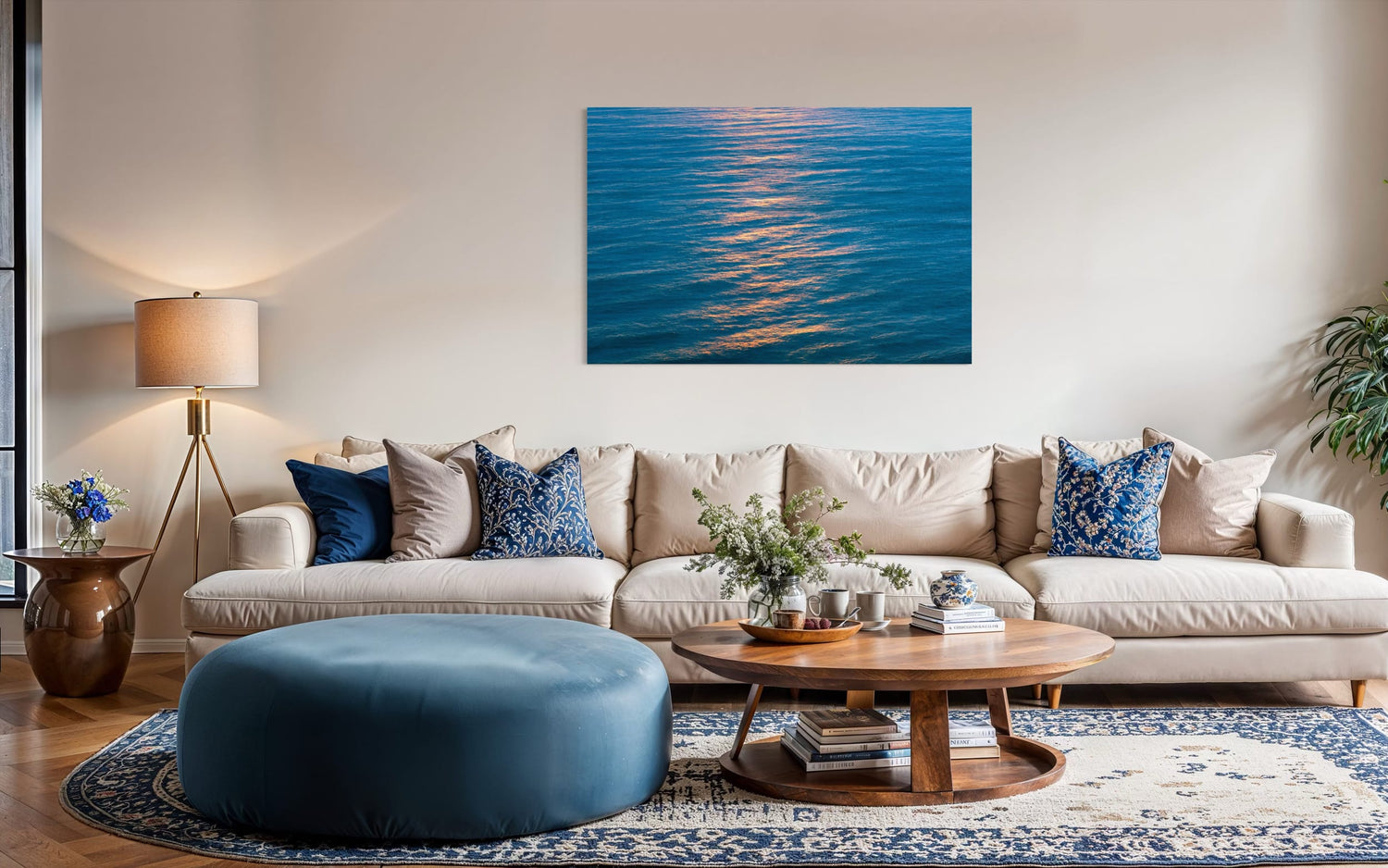 An ocean sunset photo hangs above a couch. | Lars Gesing Fine Art | Coastal Wall Art