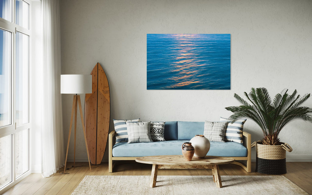 An ocean sunset photo hangs in a living room. | Lars Gesing Fine Art | Coastal Wall Art