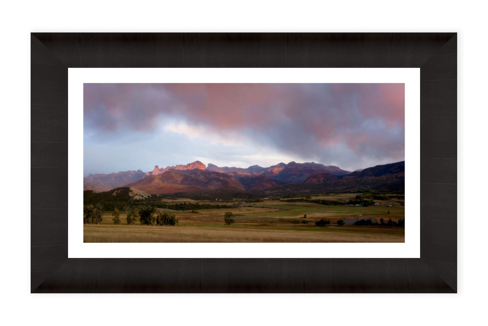 A framed Owl Creek Pass picture at sunset in Ridgway, Colorado.
