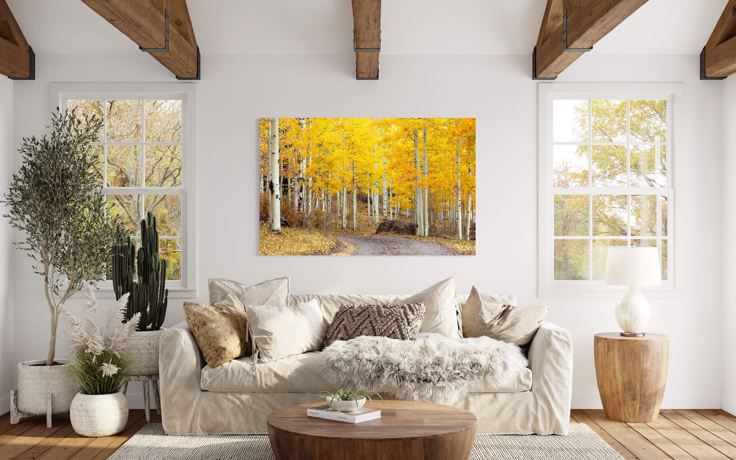 A Colorado fall colors picture from Owl Creek Pass hangs in a living room.