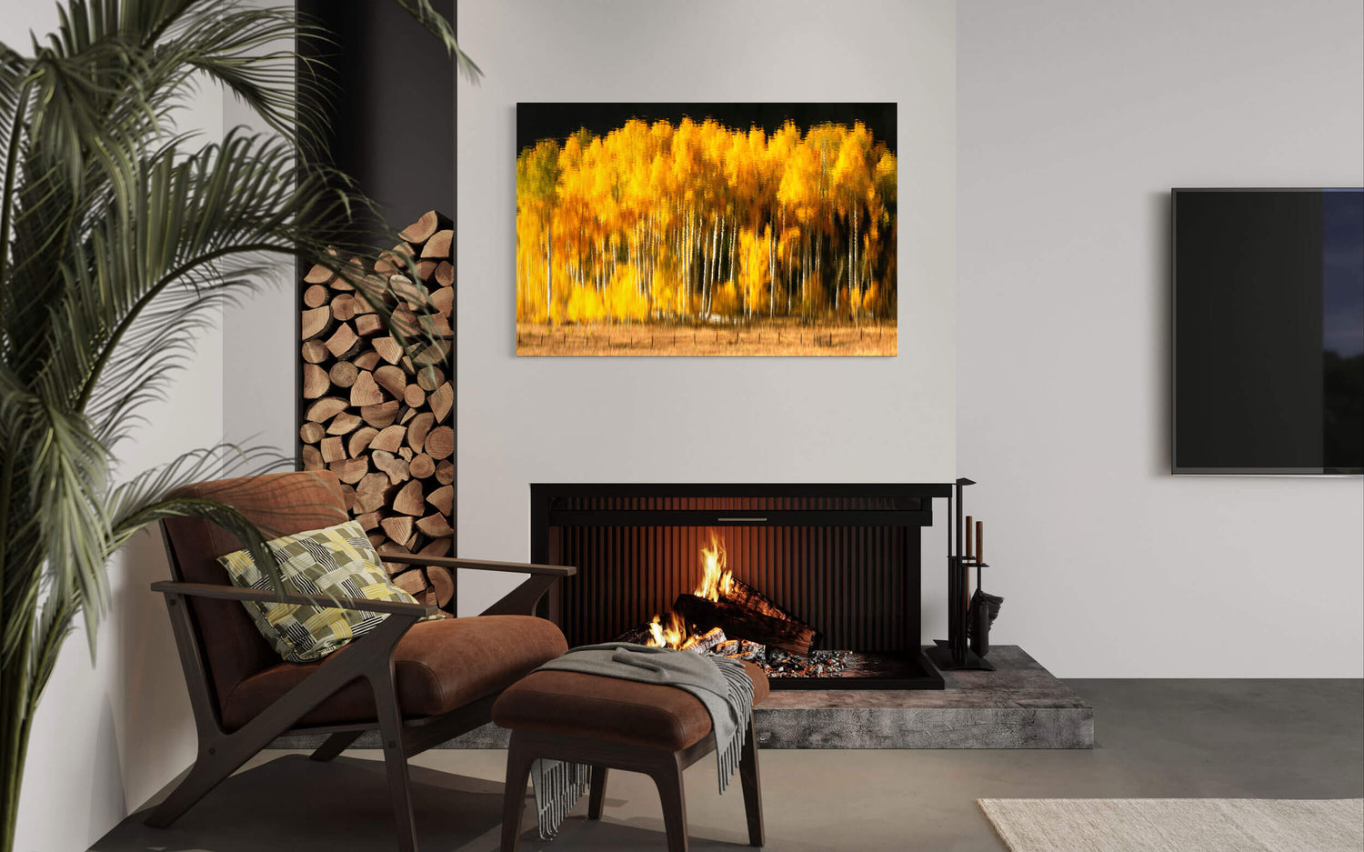 A picture of fall colors on Owl Creek Pass reflected on Rowdy Lake hangs in a living room.