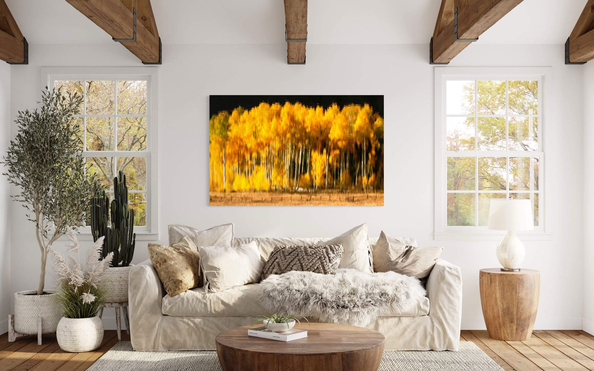 A picture of fall colors on Owl Creek Pass reflected on Rowdy Lake hangs in a living room.