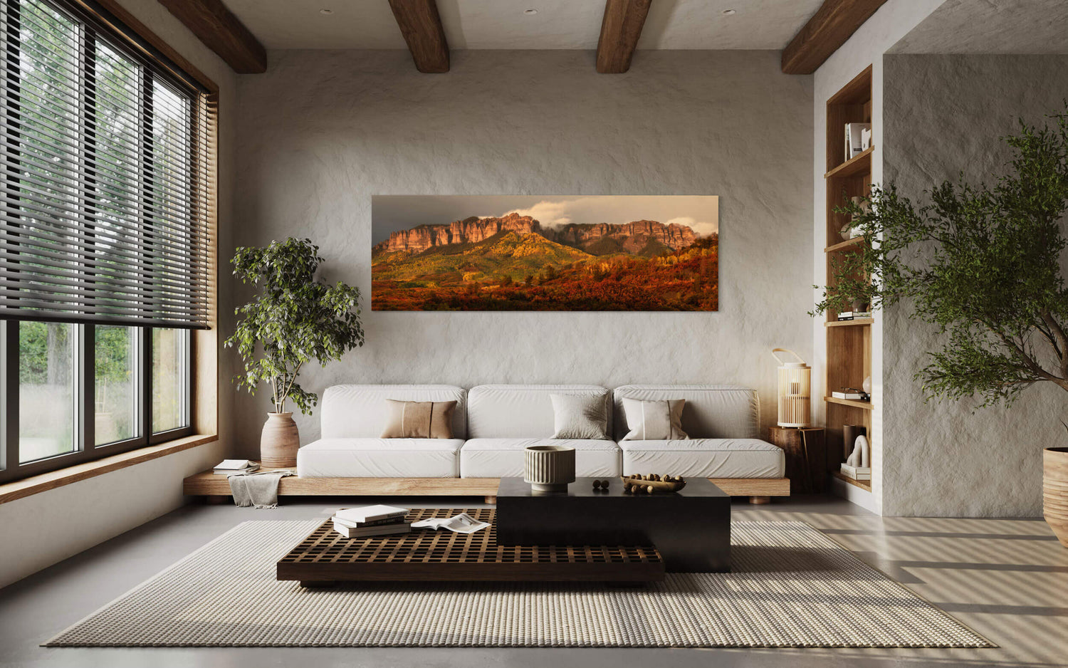 A piece of Colorado art showing the fall colors on Owl Creek Pass hangs in a living room.