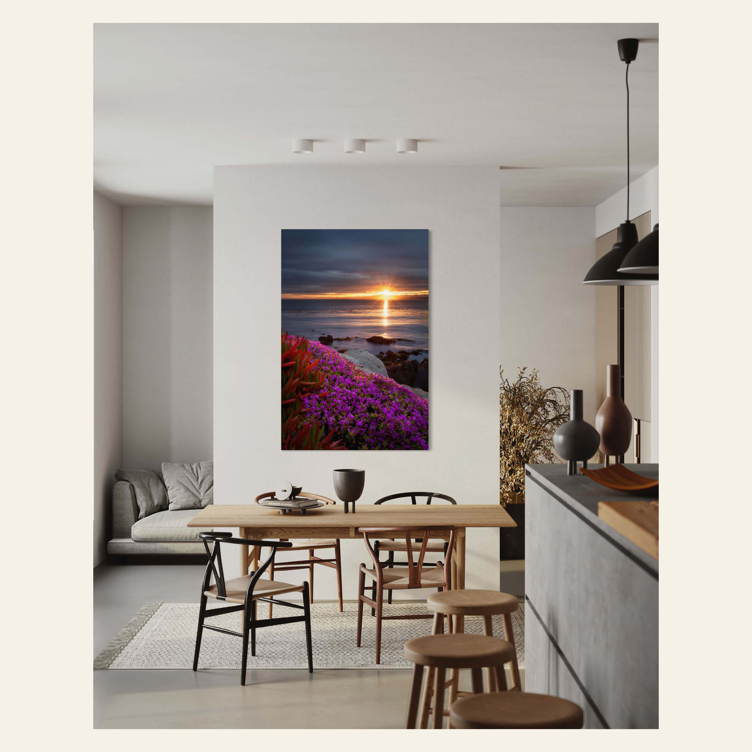 A wildflower picture of a sunrise in Pacific Grove, California, hangs in a living room.