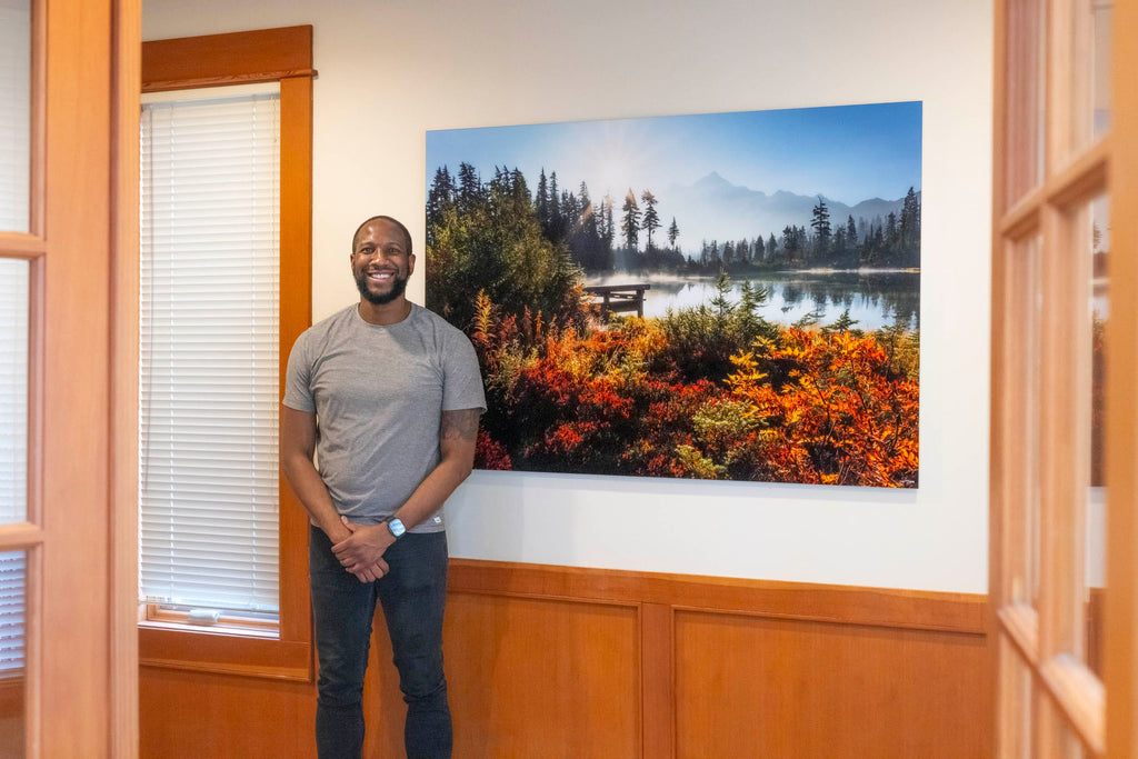 A collector with Lars Gesing's Picture Lake fine art photograph ELYSIUM from Mount Baker.