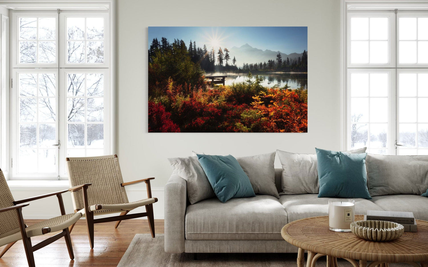 A piece of Washington art showing Picture Lake near Mount Baker hangs in a living room.