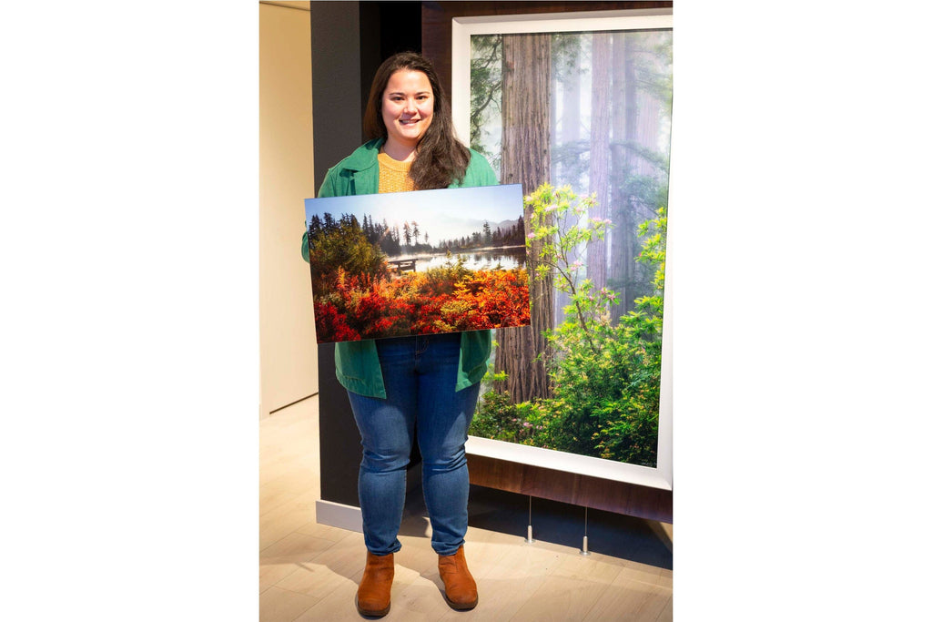 Collector Sarah Gallagher shows the fine art photograph show bought in the Lars Gesing Fine Art Nature Images gallery in West Seattle.