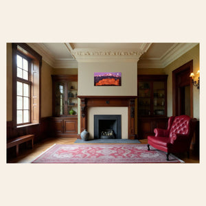 A piece of Colorado art showing a photo of Pike's Peak and the Garden of the Gods in Colorado Springs hangs above a traditional fireplace.