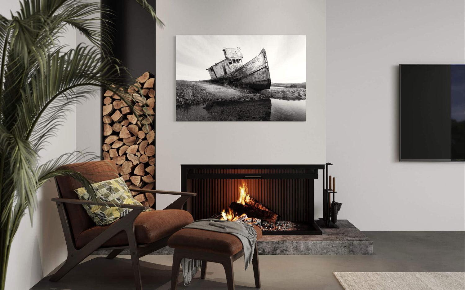 A piece of San Francisco art showing a black and white picture of Point Reyes hangs in a living room.