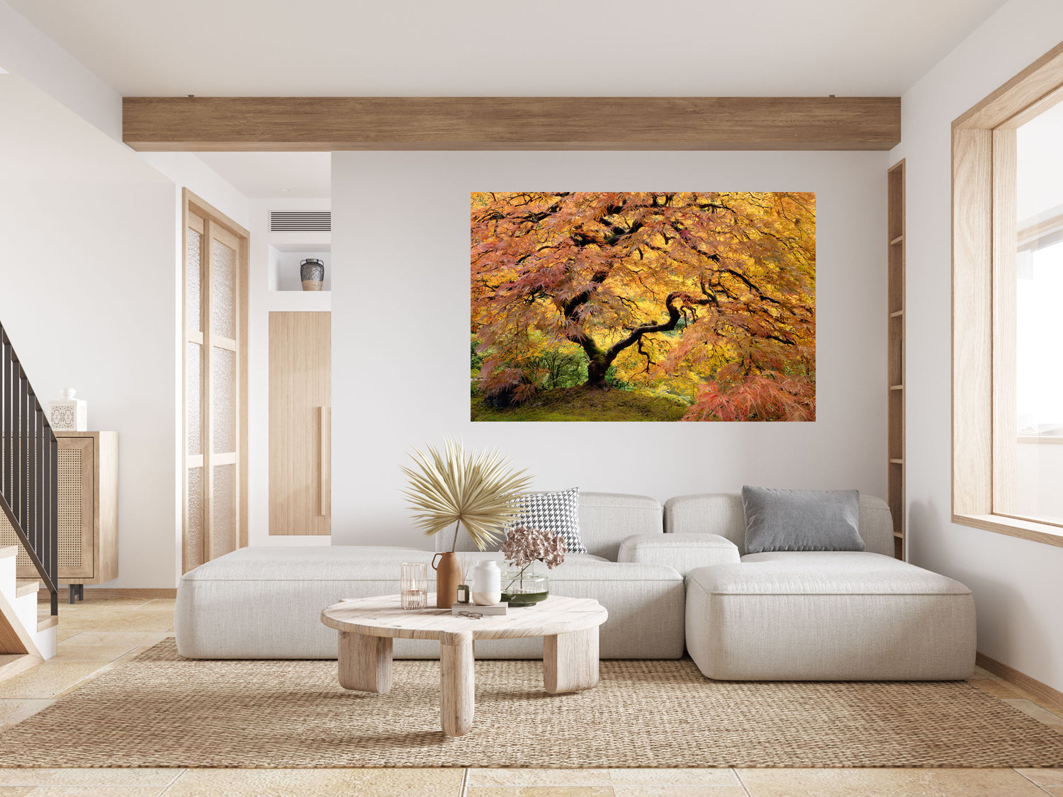 This large wall art showing a Japanese Maple picture of the famous one in the Portland Japanese Garden hangs in a living room.