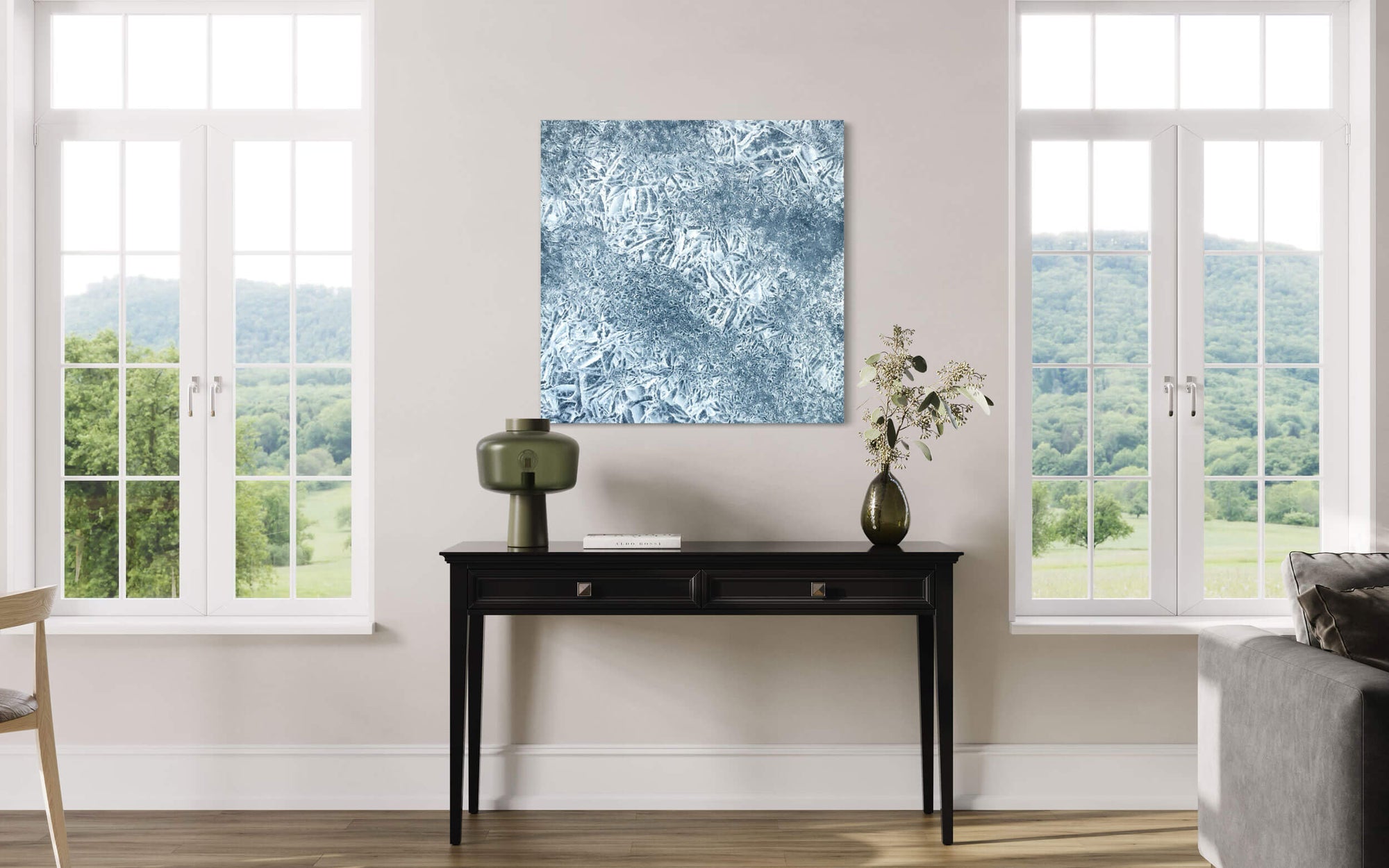 An abstract photograph of Dream Lake in Rocky Mountain National Park hangs in a living room..