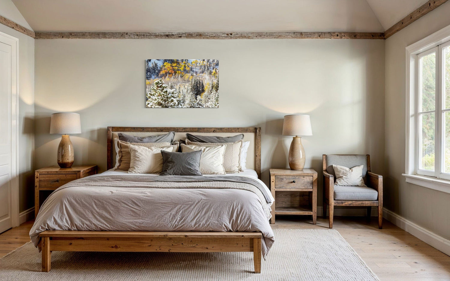 A piece of Rocky Mountain National Park art showing yellow aspen trees after snow in fall hangs in a bedroom.