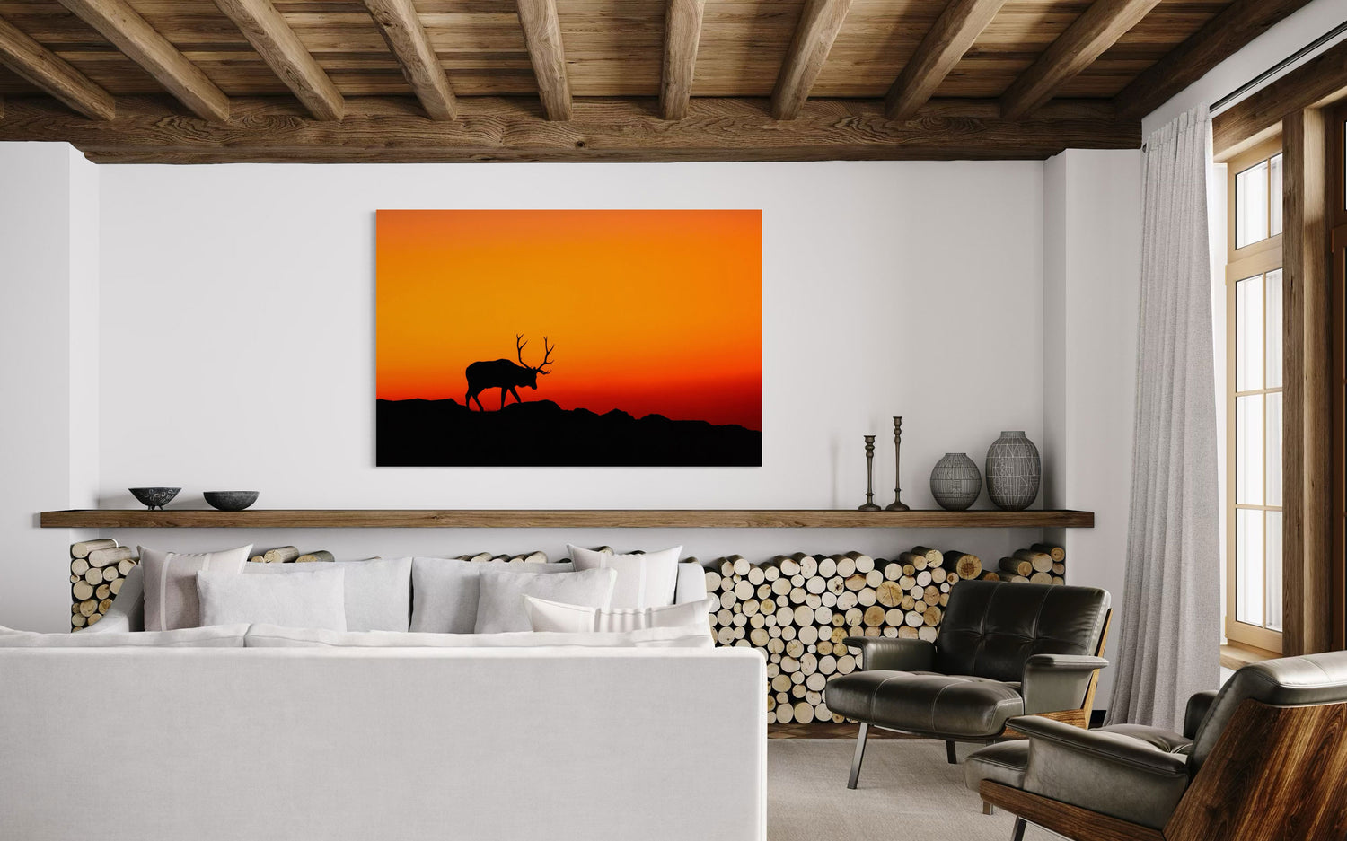 A piece of Rocky Mountain National Park art showing an elk hangs in a living room.