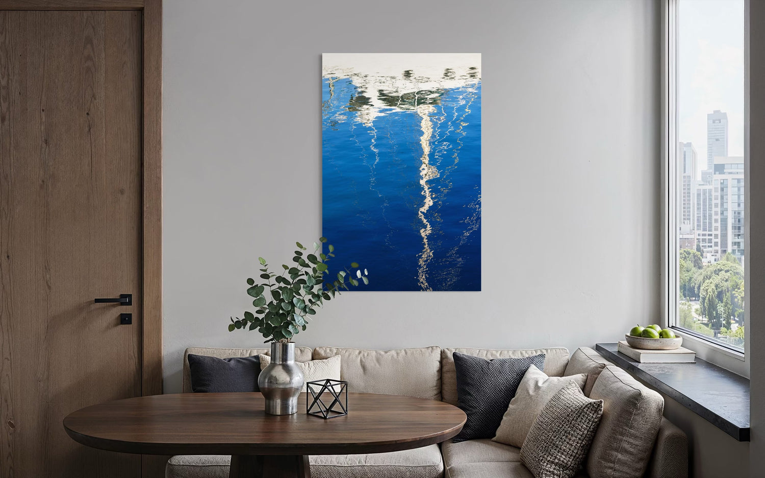 An abstract photo of a sailboat being reflected in the blue water of the San Francisco Marina hangs in a condo entryway. | Lars Gesing Fine Art | Nautical Wall Art
